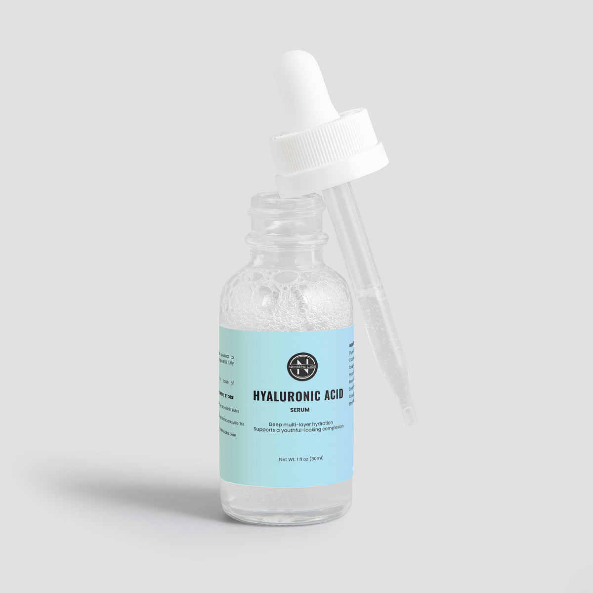 Hyaluronic Acid Serum product package arrangement on white background