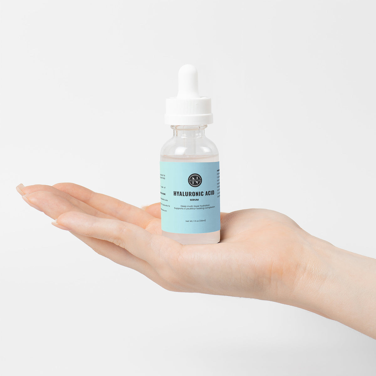 Hyaluronic Acid Serum dropper bottle displayed on open palm